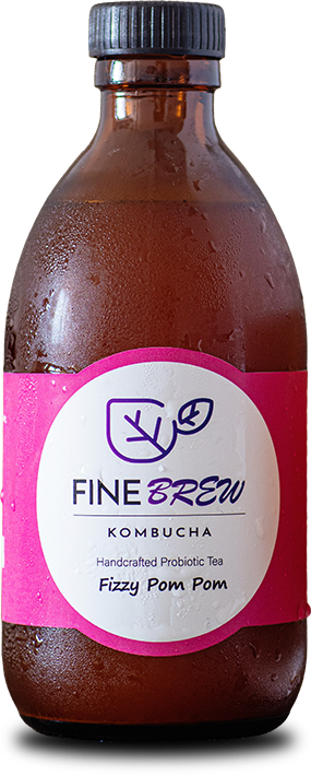 Fine Brew Fizzy Pom Pom kombucha — amber glass bottle with a hot pink handcrafted probiotic tea label, beaded with cold condensation